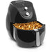 Air Fryer display with basket drawer pulled out full of cooked fries.