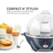 Compact N' Stylish with a beautiful round shape that fits any counter top. Egg cooker next to cooked eggs, fruit and toast.