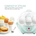 Compact N' Stylish with a beautiful round shape that fits any counter top. Egg cooker next to cooked eggs, fruit and toast.