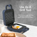 Use As A Grill Too! Make delicious single-serving portions anytime with easy-to-clean nonstick surface. Image showing nonstick Mini Waffle Breakfast Maker with egg and sausage.