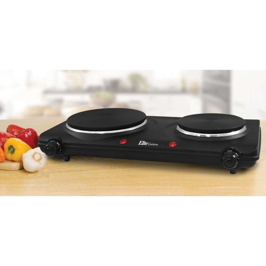 Countertop Electric Dual Flat Burner on kitchen counter next to vegetables.
