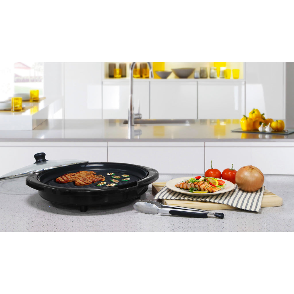 Elite Gourmet grill is on the table in the modern kitchen